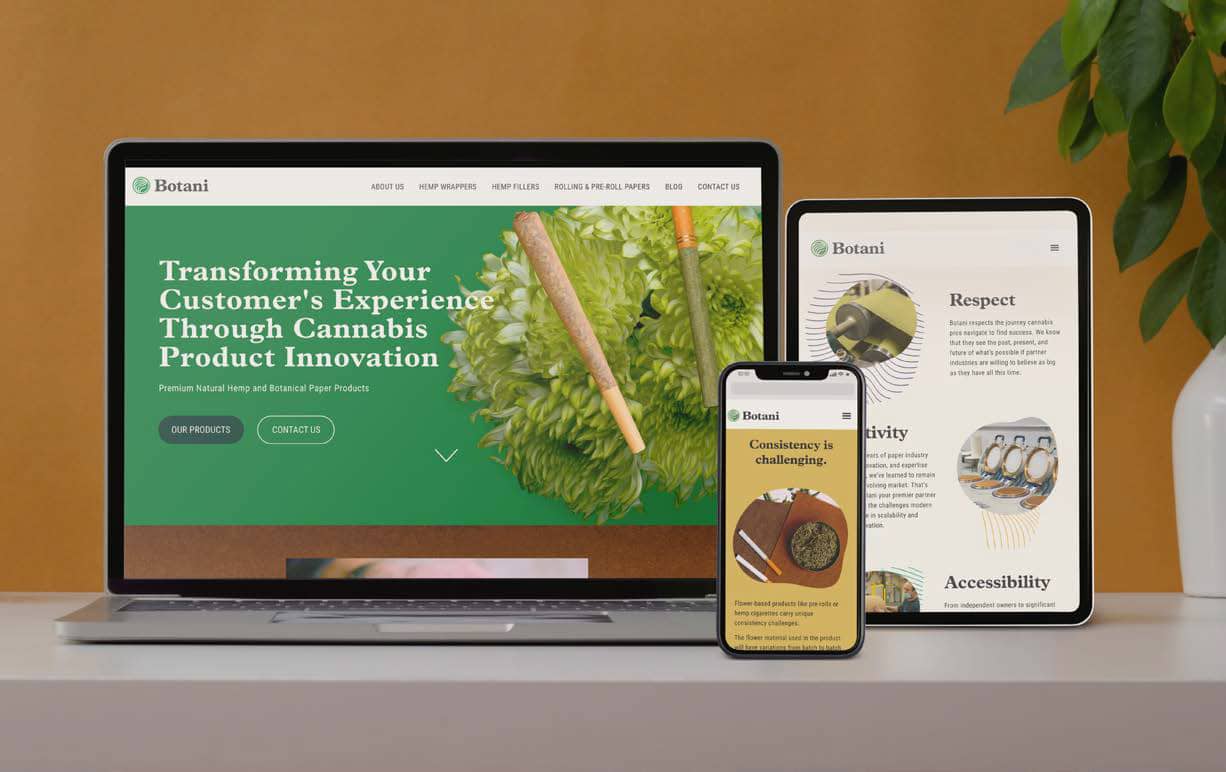 Close up view of creative worktable with Botani mock-up laptop, stationery, cup and decorations on white table with yellow wall