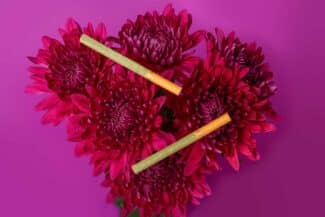 Botani Hemp Wrapped Cigarettes sitting on flowers