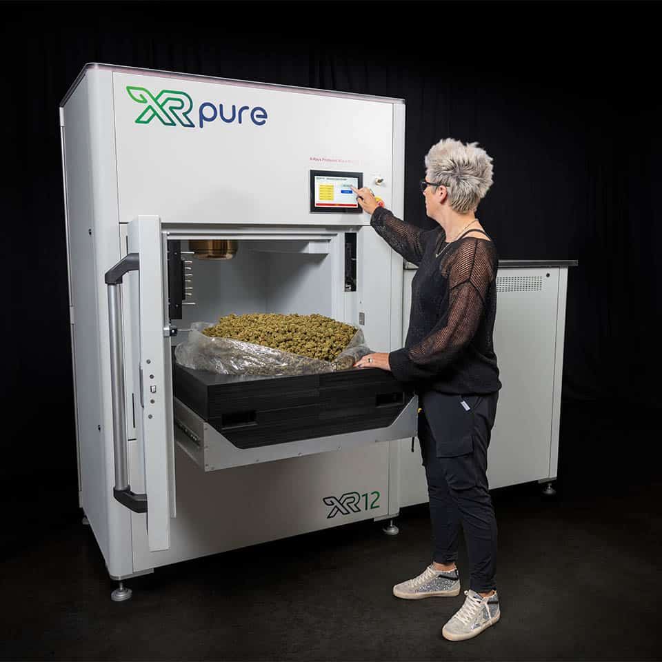 Women using XRpure XR12 Cannabis Decontamination Machine